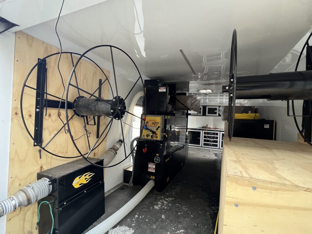 A Race Car Trailer Makes for an Awesome Cellulose Wall Spray Unit